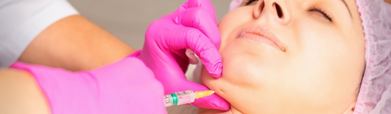 Double Chin Treatment: Understanding Non-Surgical Solutions for a Defined Jawline Person receiving non surgical double chin fat reduction treatment to slim under-chin area and improve jawline definition